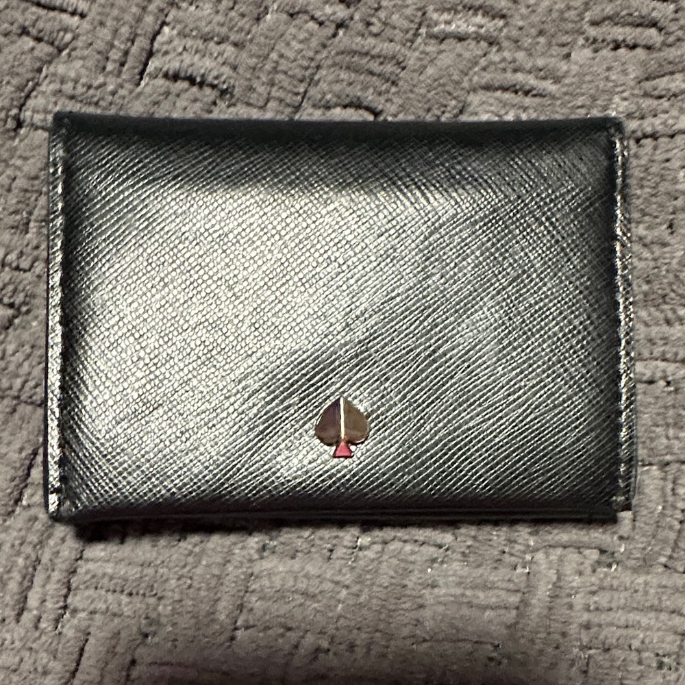 Kate Spade dark blue card holder. Has 2 card holders on each side.
